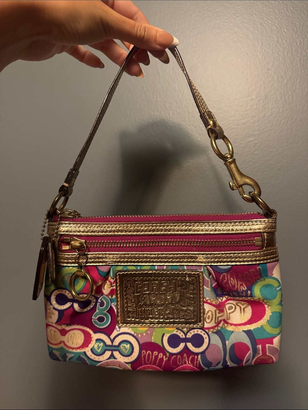 Coach Multicolor Signature Canvas Wristlet with Pink and Gold Accents